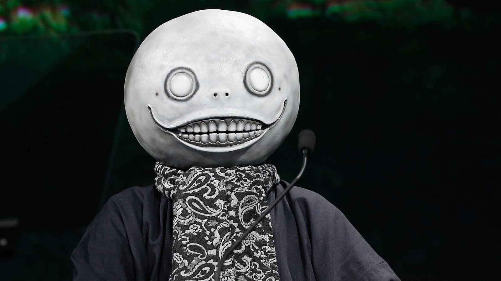 NieR creator Yoko Taro speaking at a game culture event in Tokyo